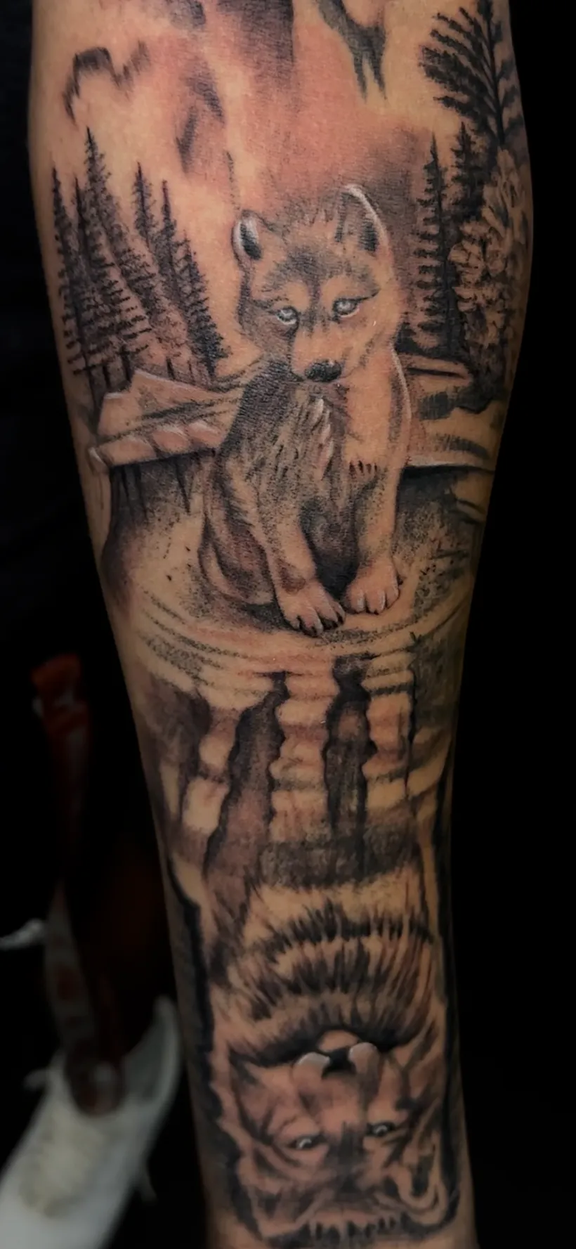 Large black and grey forest and figure tattoo