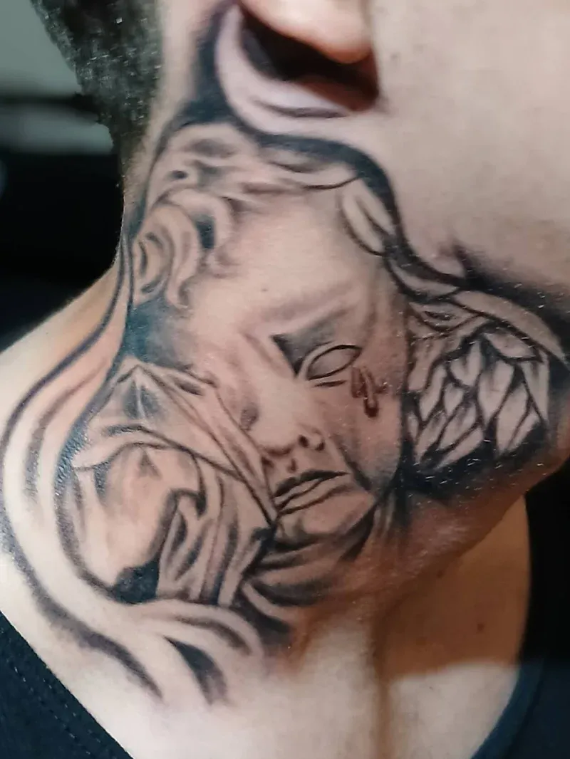 Black and grey portrait tattoo with flowing hair and wing details
